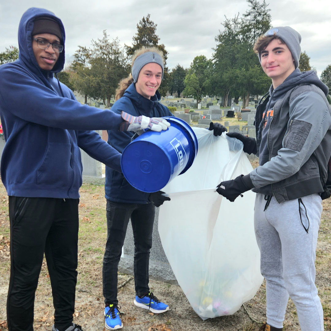 Clarke Honors College students help clean up Parsons Cemetery